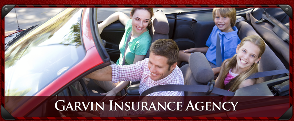 A family driving happily in a car thanks to Garvin Insurance Agency.